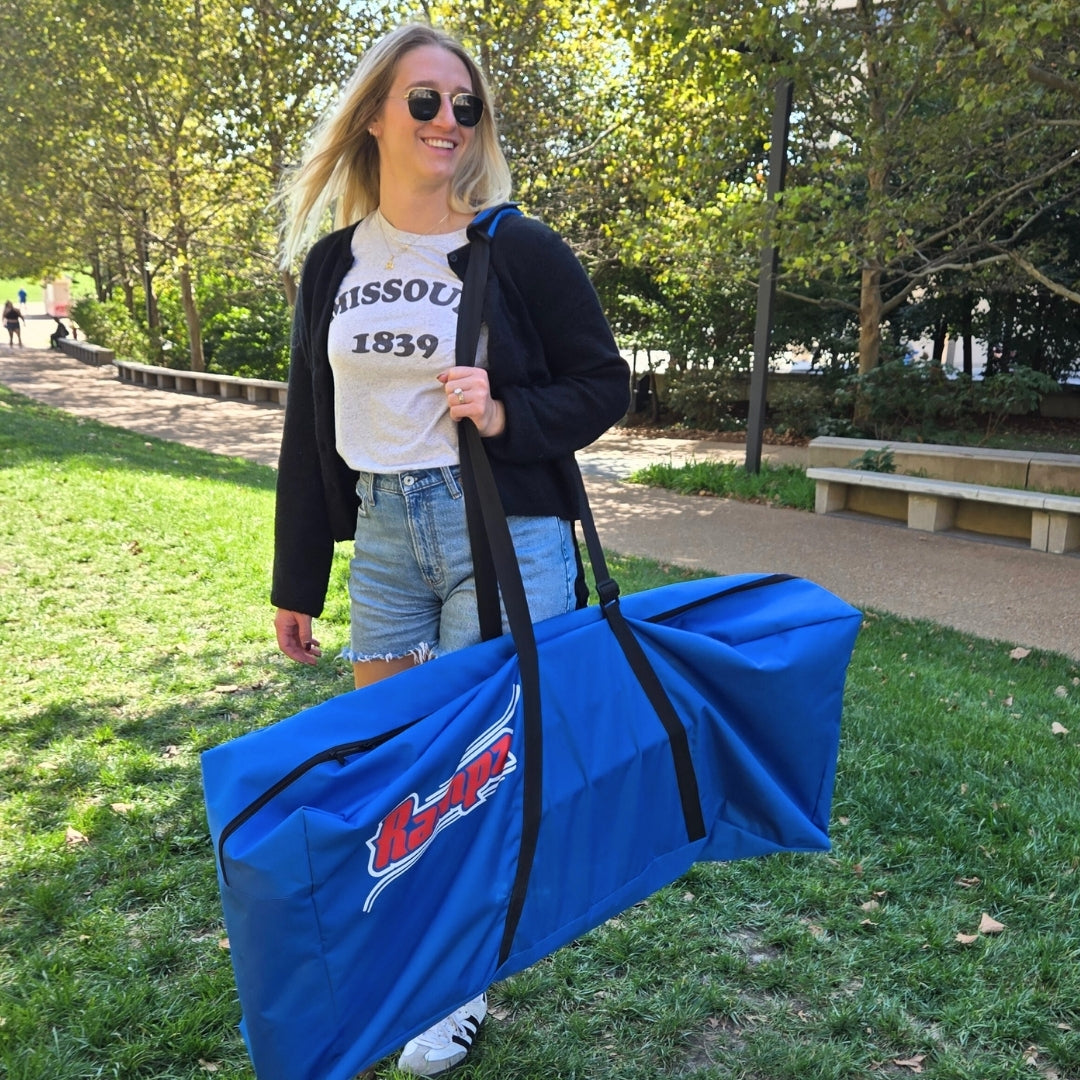 Carrying the portable Rampz Game to the park